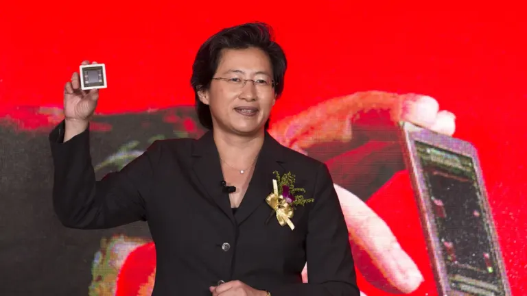 AMD CEO Lisa Su holding a processor onstage following the Ryzen 7 5800X3D Socket AM4 revival