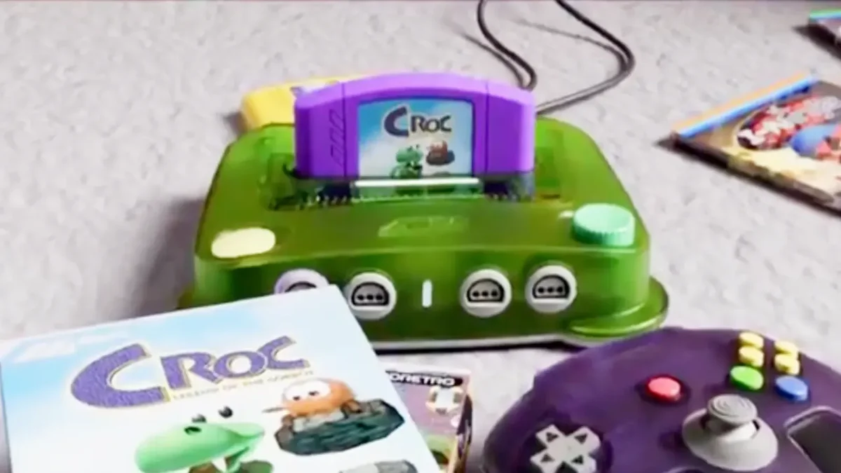 Croc Legend of the Gobbos purple N64 cartridge and cardboard box with ModRetro M64 console
