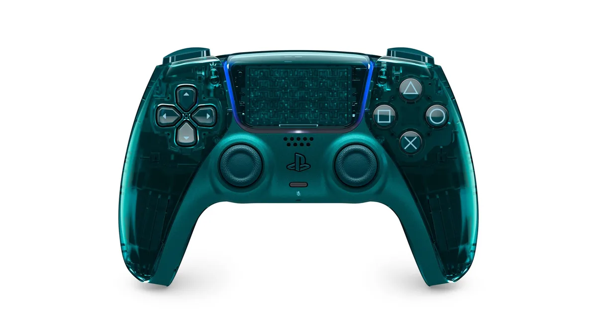 Front view of the transparent Emerald Green DualSense wireless controller showing the internal touchpad circuit board and haptic actuators