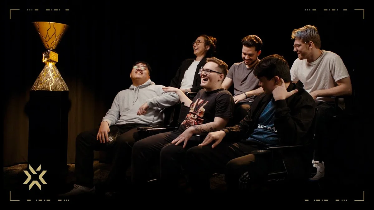 Evil Geniuses players gathered next to the VALORANT Champions trophy