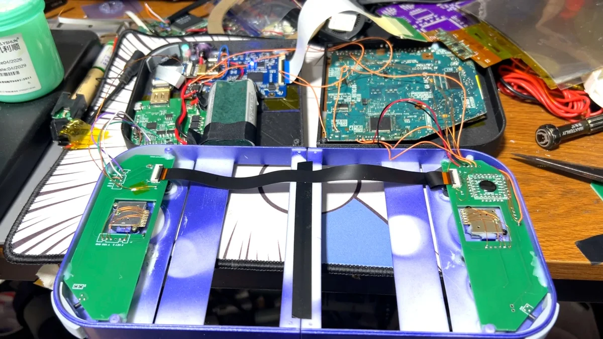 Trimmed PS2 Slim SCPH-70000 motherboard and custom dual PCBs inside the PlayStation 2 DUO