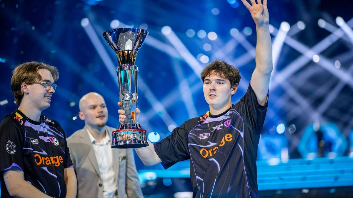 Tristan Atow Soyez and Axel Vatira Touret lifting a trophy on the Rocket League Championship Series stage